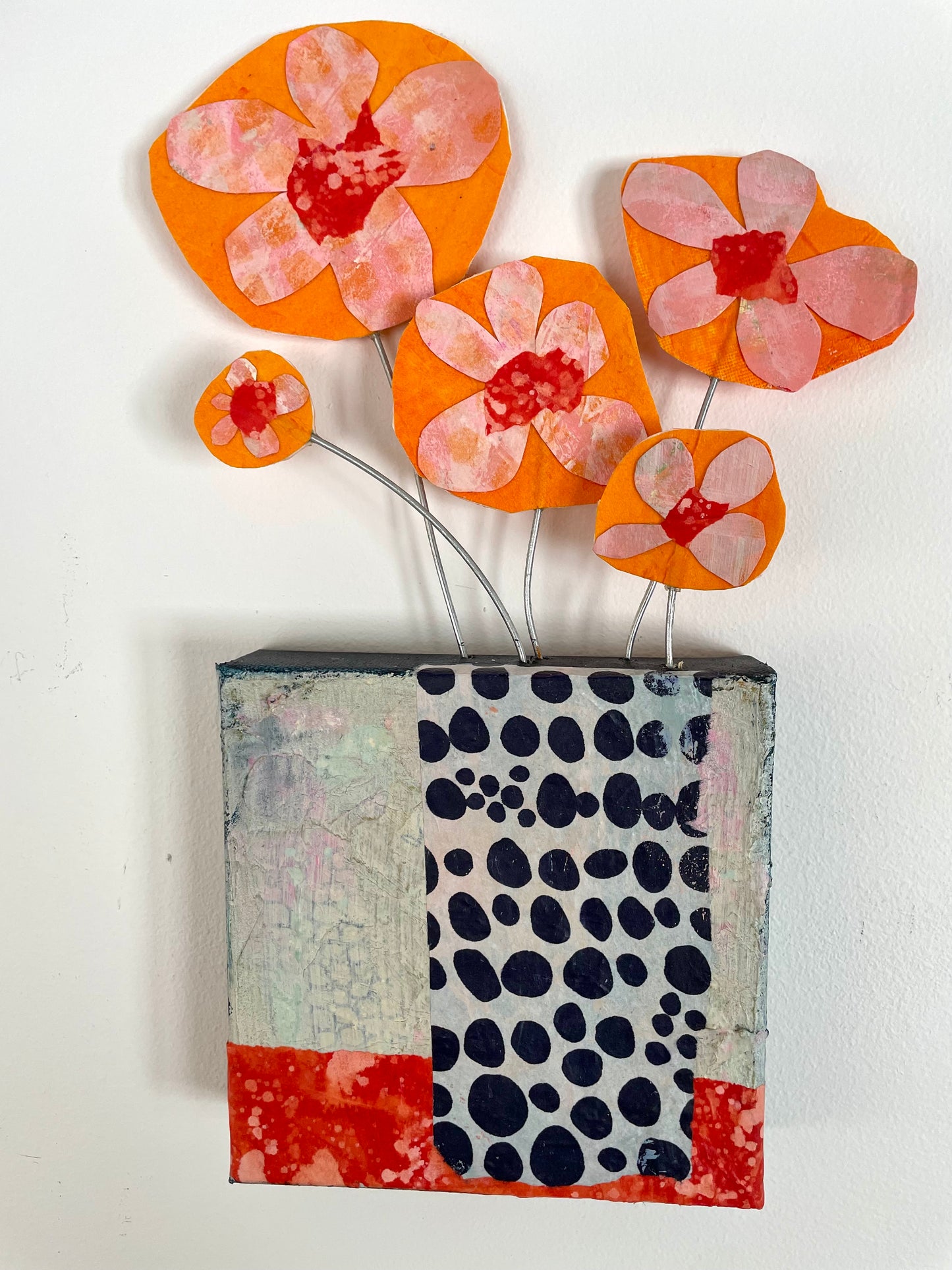 "Orange Blooms Escaping" $100 6"x 13.5" canvas and sculptural flowers