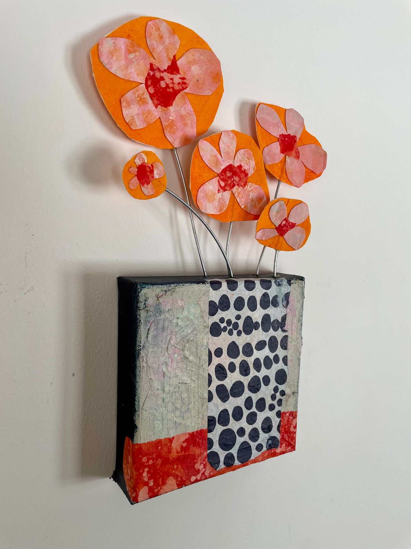 "Orange Blooms Escaping" $100 6"x 13.5" canvas and sculptural flowers